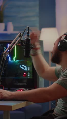 male gamer streaming and reacting while playing on a high-performance pc