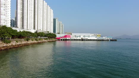 Hong-Kong-Butterfly-beach-area-skyscrapers-and-Ocean-walk,-low-angle-aerial-view