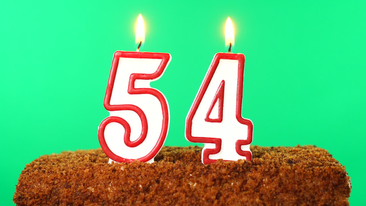 Cake with the number 54 lighted candle. Chroma key. Green Screen. Isolated