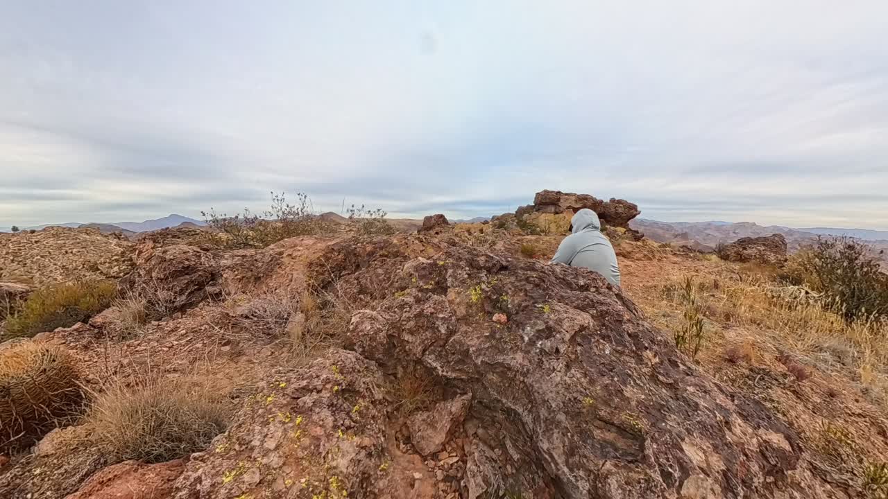Cloud Time Lapse of Weaver Needles and a hiker resting in the Superstition Mountains