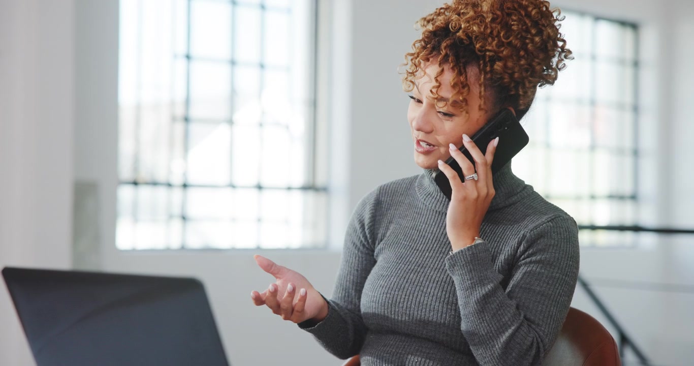 Young Woman Talking on Smartphone in Modern Office