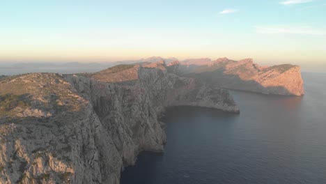 Aerial-footage-of-mountains-and-sea,-beautifull-sunrise-on-the-island