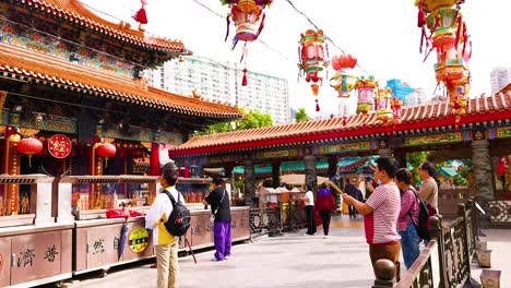 people exploring the vibrant temple in hong kong