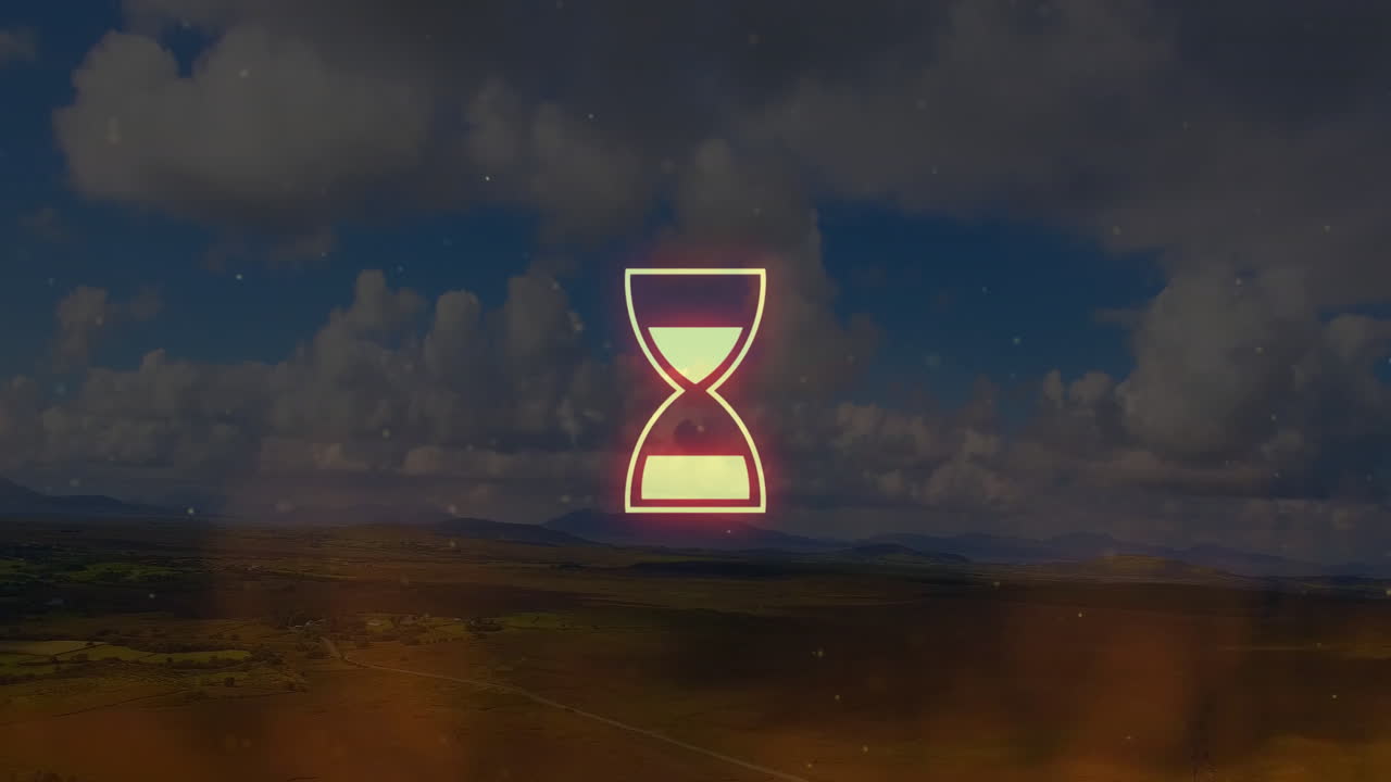 Animating abstract shapes over scenic landscape with cloudy sky background