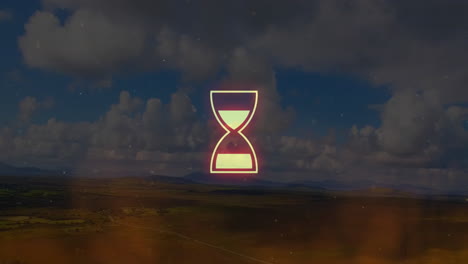 animating abstract shapes over scenic landscape with cloudy sky background