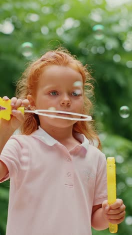 little girl playing with bubbles