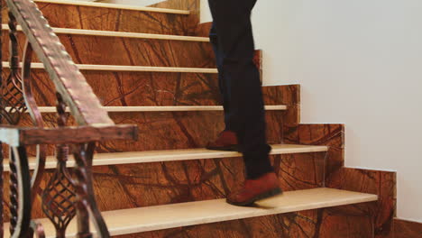 close up of business people legs moving on stairs