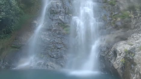 waterfall flowing water from mountain at forest from flat angle video taken at thangsingh waterfall shillong meghalaya india