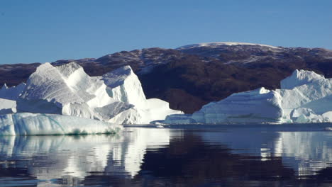 traveling among icebergs in east greenland fjords