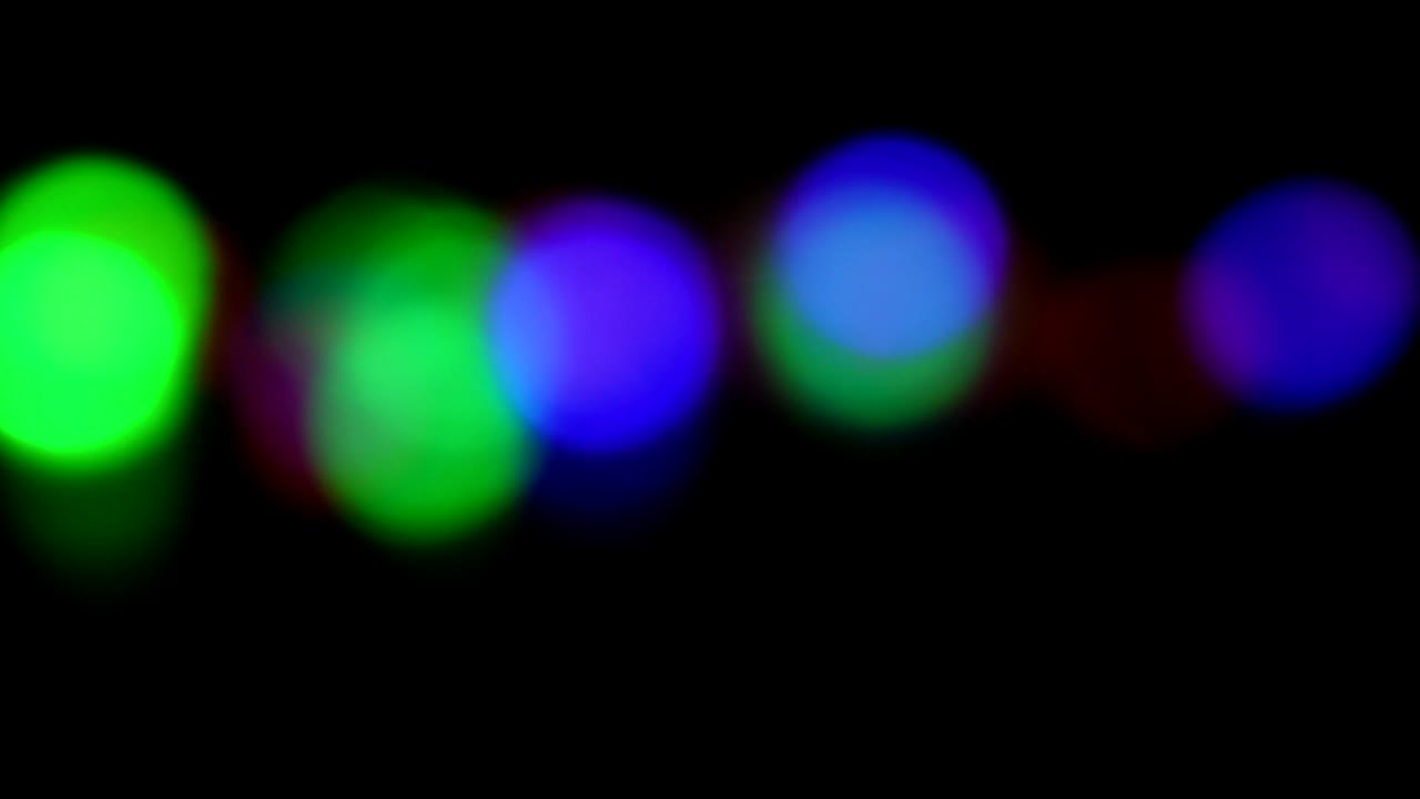 Blurred colorful lights. Light bokeh from Xmas tree.