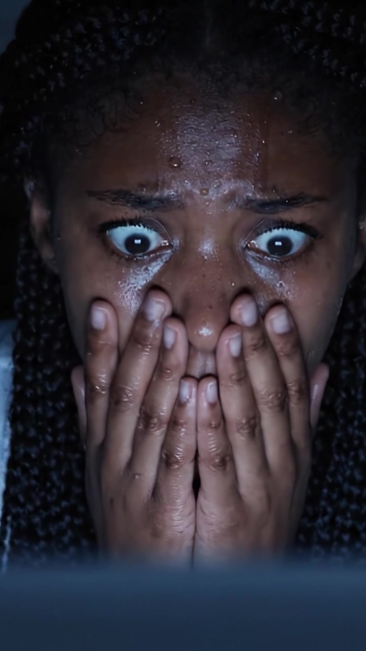 A Strong Emotional Reaction: Witnessing a Haunting Moment on Screen That Leaves the Subject Terrified and Anxious, Captured in Two Frames of Pure Suspense and Tension