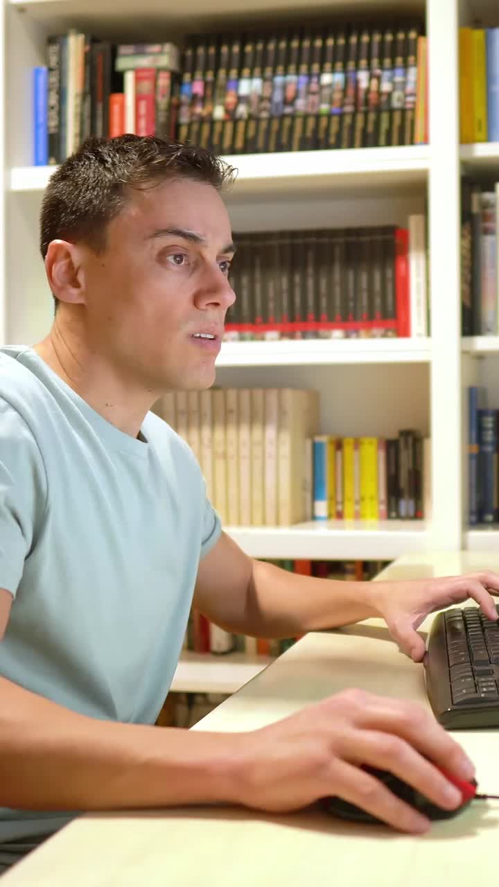 Man using computer at desk in home office