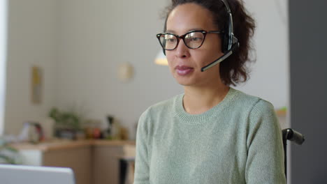 businesswoman in wheelchair talking on web call