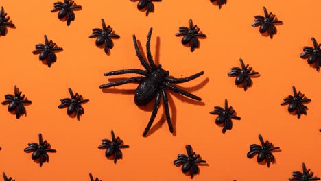 Animation-of-spiders-on-orange-background