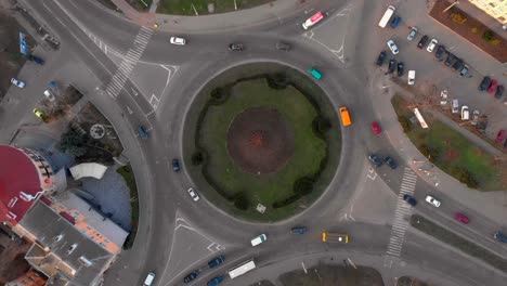 4k aerial view timelapse of roundabout road with circular cars.