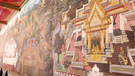 detailed mural depicting thai architecture and landscapes