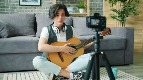 Teenager Vlogger Playing Acoustic Guitar at Home