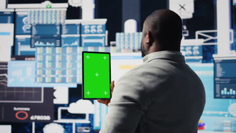 african american leader reviewing mockup screen with data insight