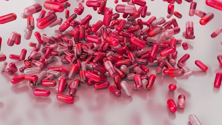Pillole, farmaci, capsule che cadono su un ripiano bianco, rallentatore, primo piano 4K
