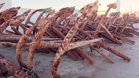 Rusted-ship-anchors,-ship-wreckage,-silent-testament-to-the-passage-of-time-and-the-corrosive-touch-of-salt-laden-air