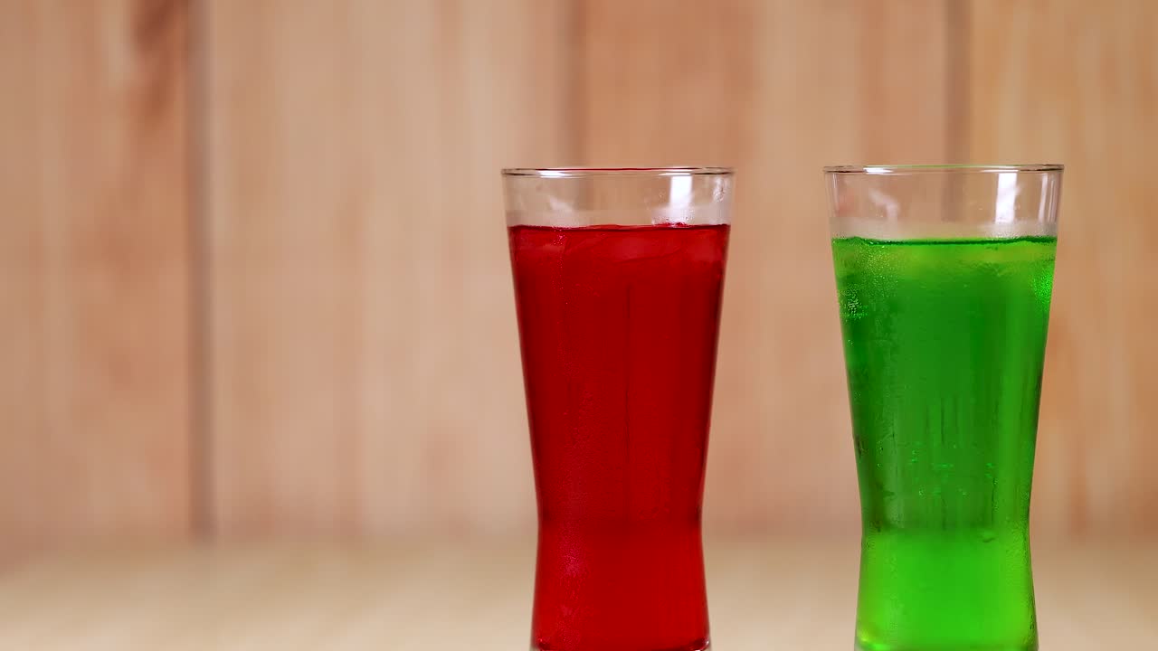 Two glasses clinking in a celebratory toast