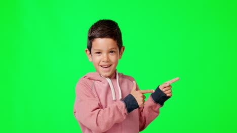 Happy,-face-and-pointing-boy-on-a-green-screen