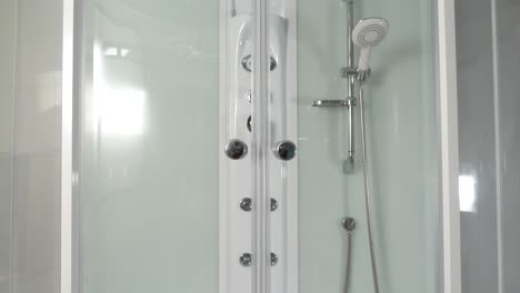 modern shower stall with hands