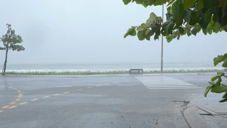 Big-Sea-Waves-During-Tropical-Storm-Crashing-on-Coast-by-Coastal-Road,-Handheld