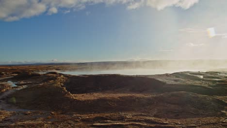 pan past geothermal hot spring in a volcanic landscape in iceland