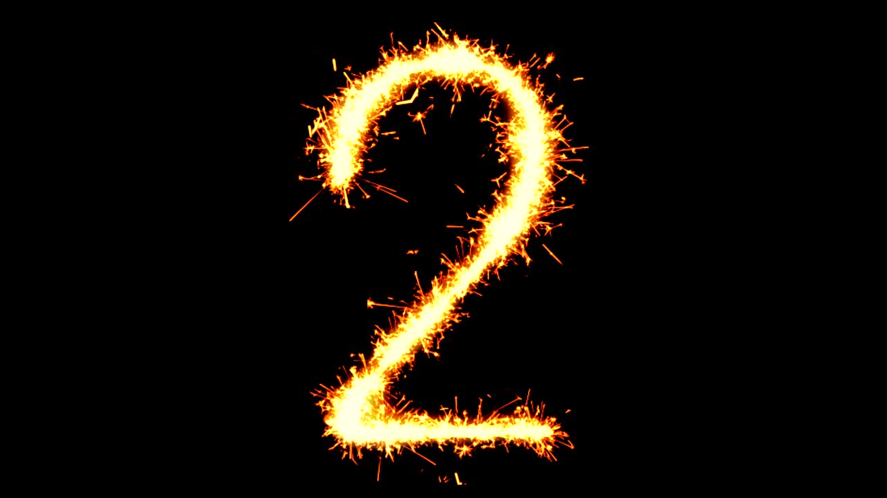 número 2 texto chispa chispa chispas fuego de artificio bucle de animación