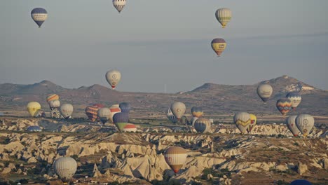 popular hot air ballooning over unique cappadocia landscape with hoodoos, turkey