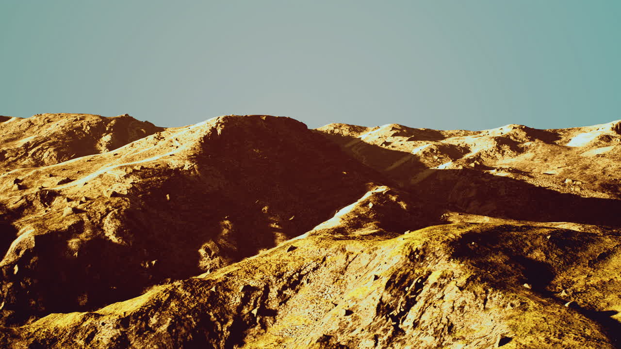 majestuoso paisaje montañoso bajo un cielo azul claro durante las horas de luz del día
