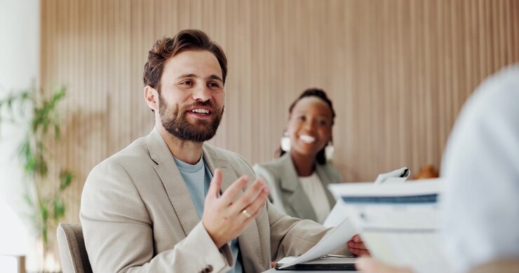 Professional Man Leading a Business Meeting in a Modern Office