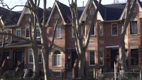 row of townhomes in city in fall in day exterior