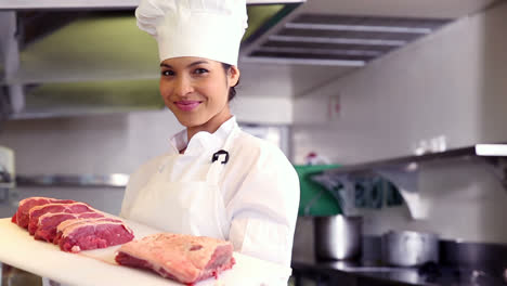 Chef-showing-board-of-sliced-beef