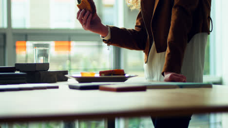 Female-executive-having-food-at-her-desk