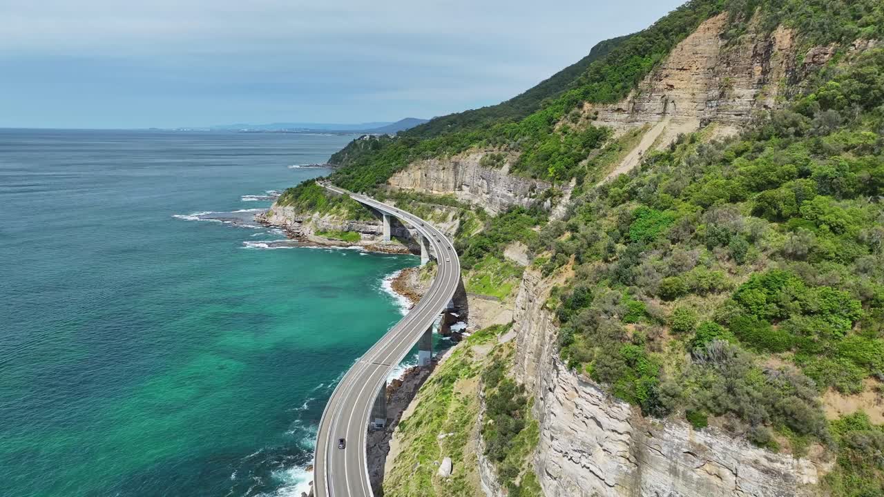 Sea Cliff Bridge and Lawrence Hargrave Drive winding through coastal cliffs and ocean