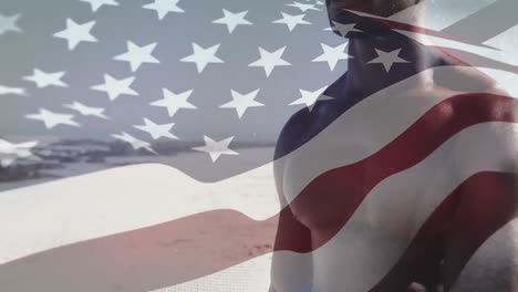 animación de la bandera de los estados unidos de américa sobre un hombre afroamericano en la playa