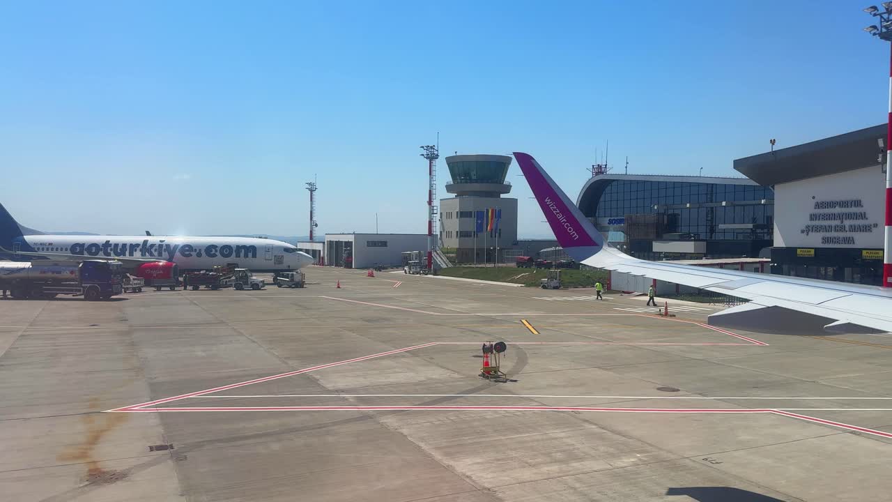 Airplane plane wing Suceava airport tarmac Romania Airbus A320 window view