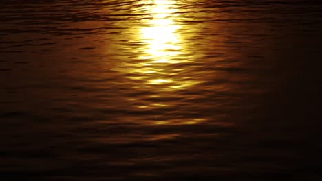 yellow sea surface with the sparkling sunset or sunrise