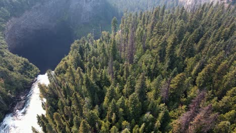 edge of the impressive helmcken falls along the murtle river in wells gray provincial park in british columbia, canada