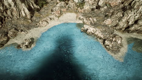 aerial-view-from-flying-drone-of-rocky-island-in-Atlantic-ocean