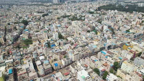 bengaluru, the capital of karnataka, is depicted in dramatic aerial footage as a busy residential neighbourhood encircled by single-family homes and apartment buildings