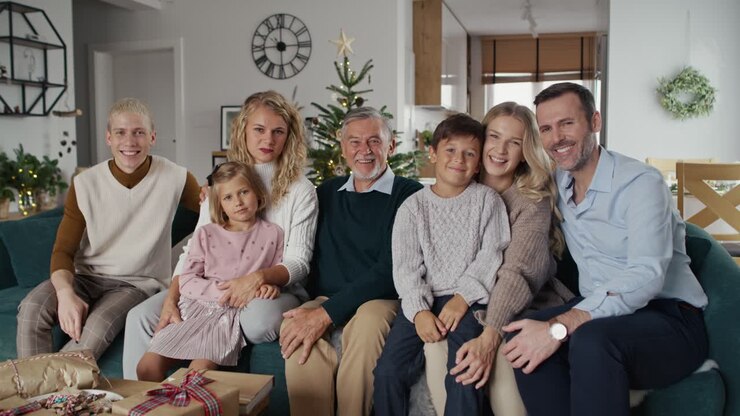 Portrait of elegant caucasian family sitting and looking at camera.