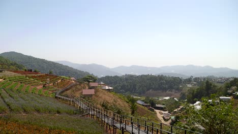 Beautiful-panorama-view-over-Mon-Jam,-Thailand-with-mountains-in-distance