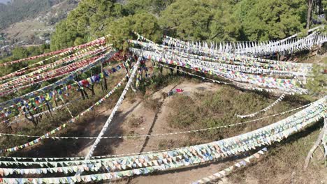 drone aerial view of monastery buddhist peaceful flags flying