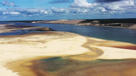 banc d'arguin in arcachon france flooded with boats on the shore at the south passage, aerial dolly out shot