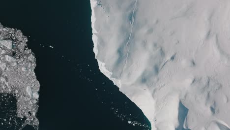 drone over sea and ice of ilulissat icefjord