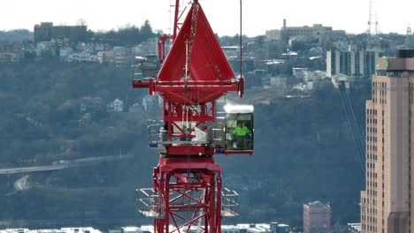 tower crane turning through static aerial shot with long zoom