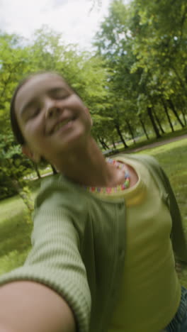 a happy girl playing outdoors in a park
